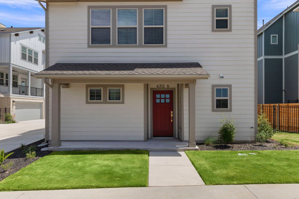 6312 Stockman Drive, Unit 6 Austin, TX 78747 - Photo 2 of 35 a view of a house with a yard