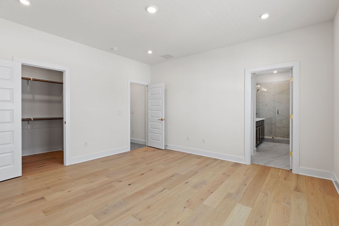 6312 Stockman Drive, Unit 6 Austin, TX 78747 - Photo 25 of 35 wooden floor in an empty room with a window