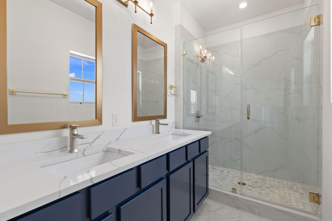 6312 Stockman Drive, Unit 6 Austin, TX 78747 - Photo 26 of 35 a bathroom with a shower sink and mirror