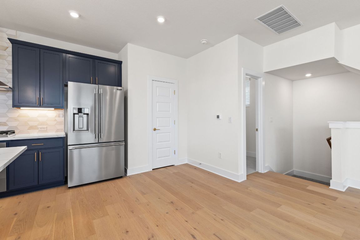 6312 Stockman Drive, Unit 6 Austin, TX 78747 - Photo 7 of 35 a kitchen with a refrigerator and a refrigerator