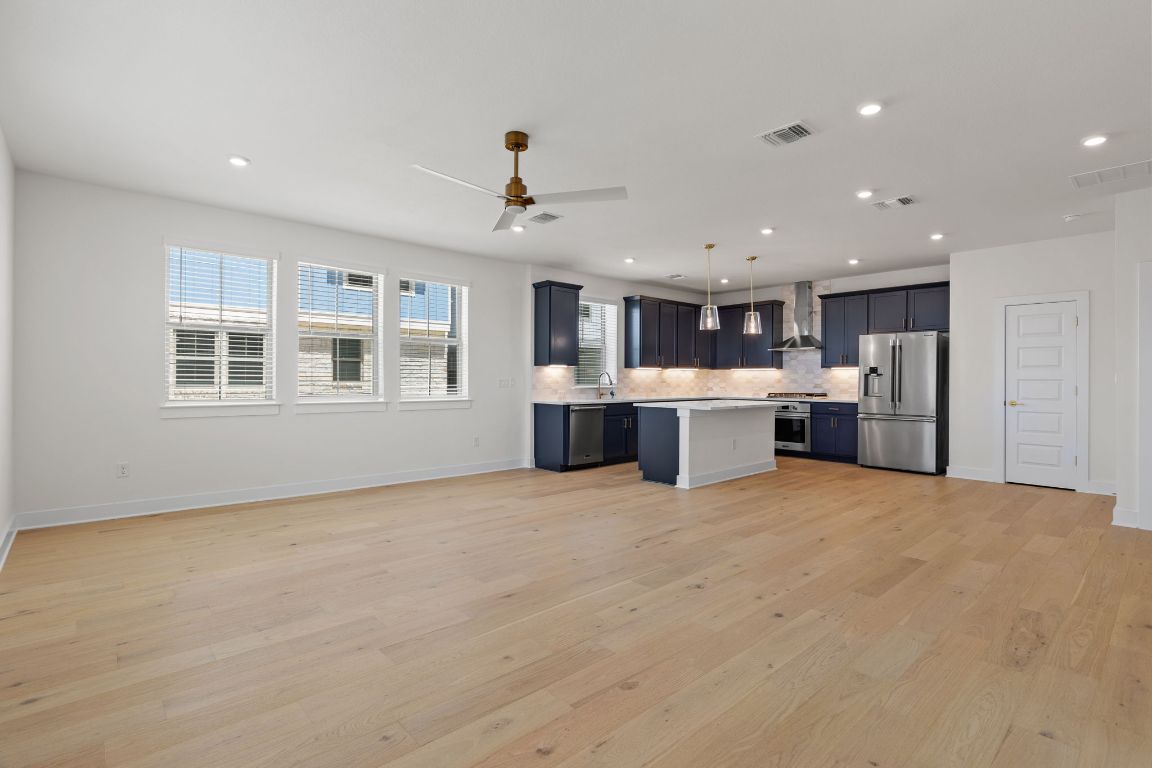6312 Stockman Drive, Unit 6 Austin, TX 78747 - Photo 9 of 35 a view of kitchen with stainless steel appliances refrigerator stove microwave and cabinets