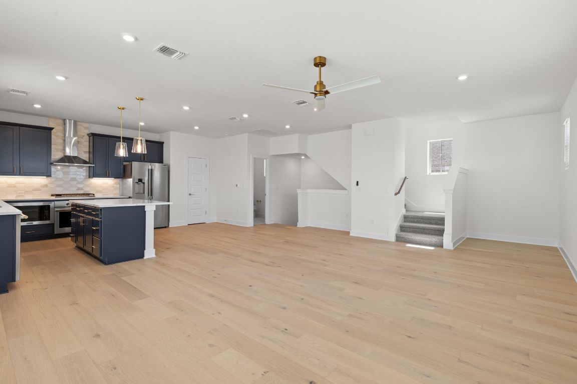 6312 Stockman Drive, Unit 6 Austin, TX 78747 - Photo 10 of 35 a view of kitchen with kitchen island a sink stainless steel appliances and cabinets