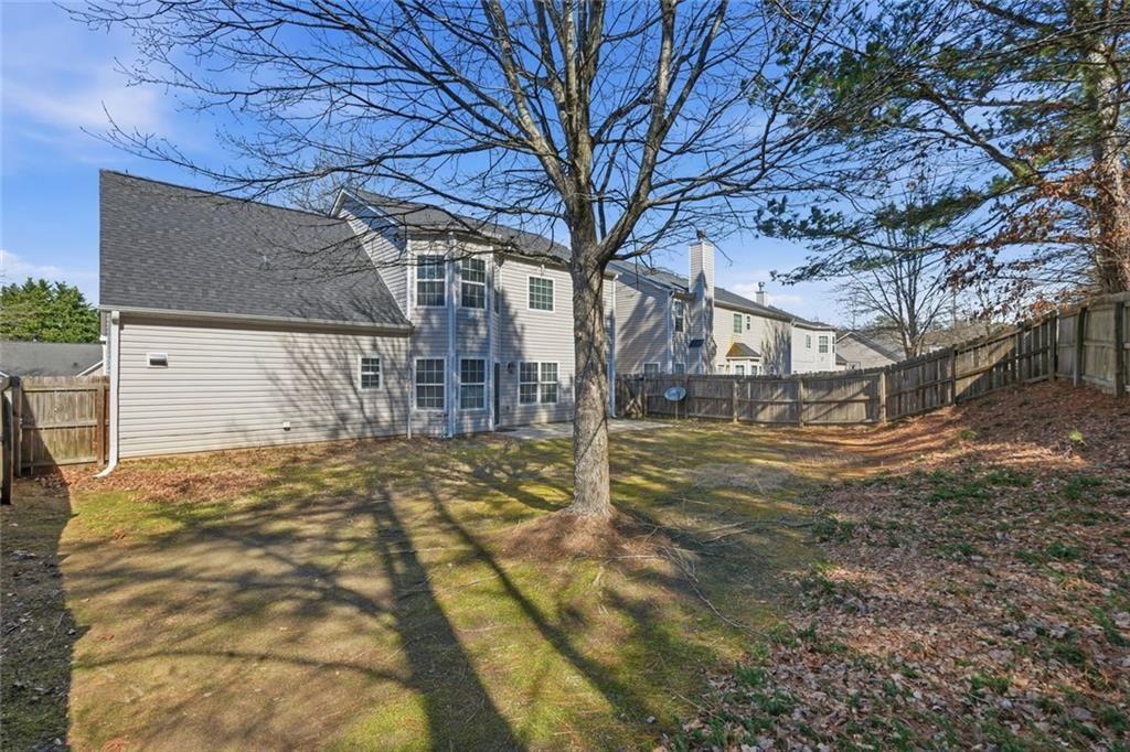 3570 Bogan Mill Road Northeast Buford, GA 30519 - Photo 29 of 31 a view of a yard with wooden fence