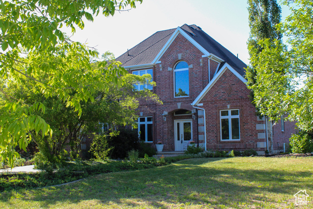 5626 South North Fork Road Eden, UT 84310 - Photo 1 of 1 View of front of house featuring brick siding and a front lawn