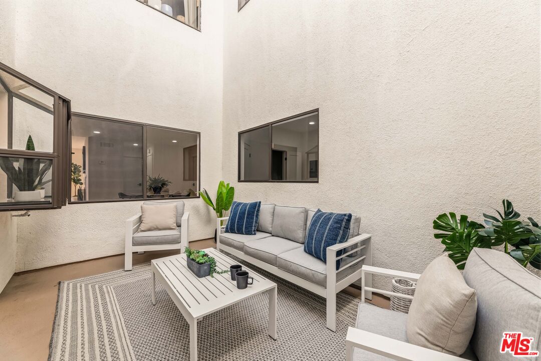 311 Bora Bora Way, Unit 3207 Marina del Rey, CA 90292 - Photo 19 of 54 a living room with furniture and a potted plant