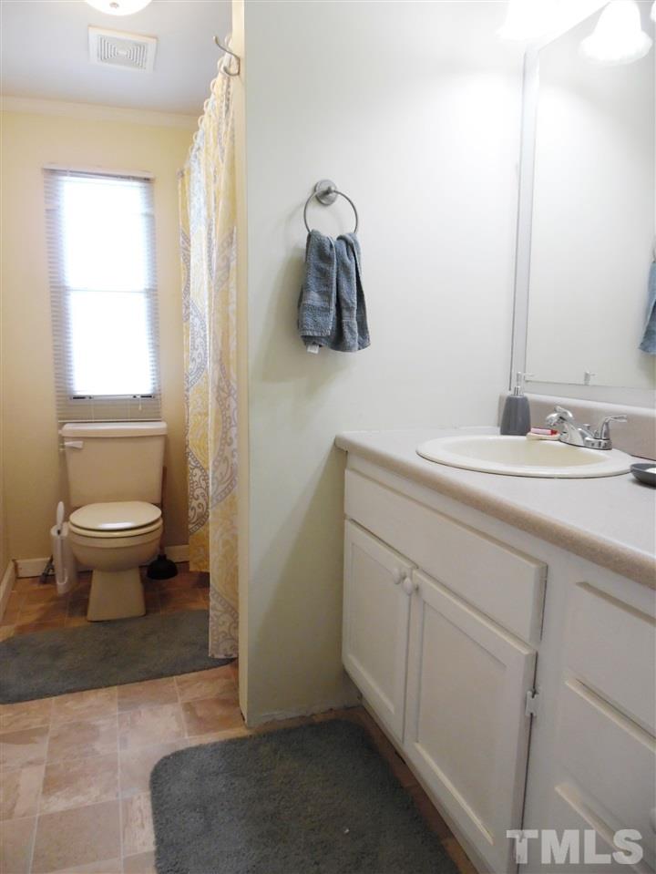 15 Rhode Island Way Cameron, NC 28326 - Photo 12 of 17 a bathroom with a sink toilet and mirror