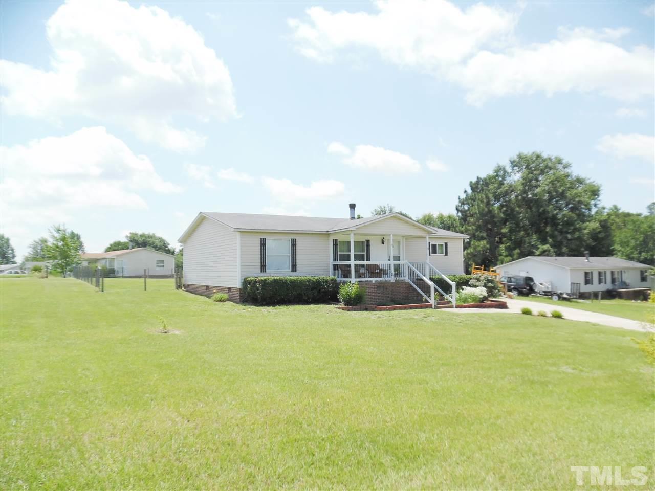15 Rhode Island Way Cameron, NC 28326 - Photo 14 of 17 a view of a house with a yard and sitting area