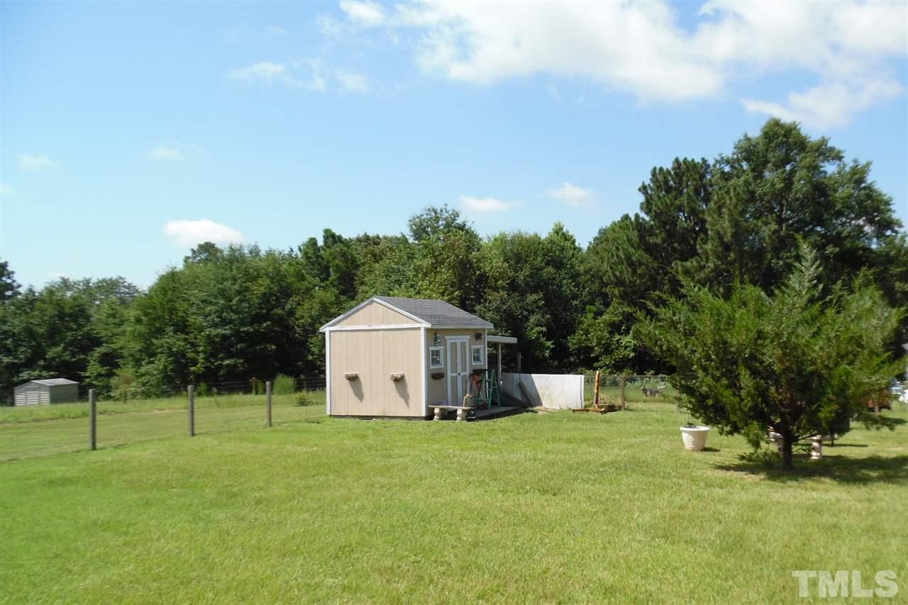 15 Rhode Island Way Cameron, NC 28326 - Photo 16 of 17 a view of a tiny house with a yard