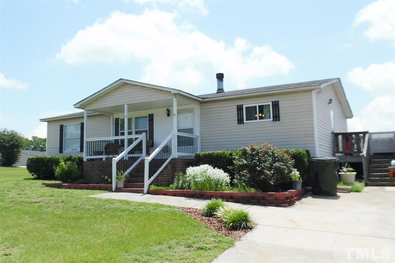 15 Rhode Island Way Cameron, NC 28326 - Photo 2 of 17 a front view of a house with a yard