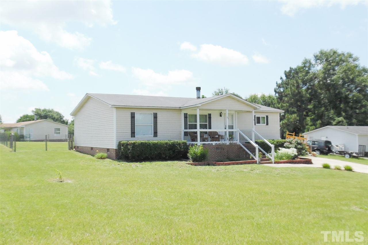 15 Rhode Island Way Cameron, NC 28326 - Photo 3 of 17 a front view of house with yard and seating area