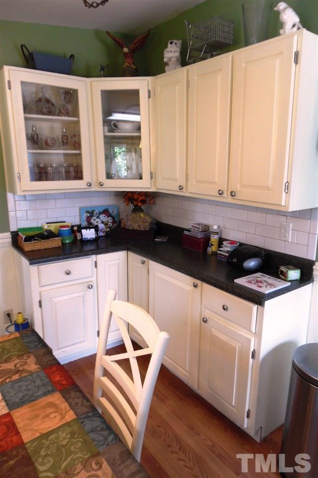 15 Rhode Island Way Cameron, NC 28326 - Photo 9 of 17 a kitchen with granite countertop a sink a stove and cabinets