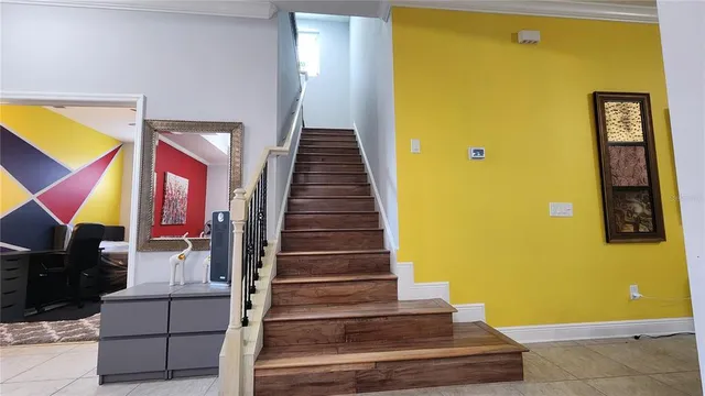 a view of entryway and hall with wooden floor