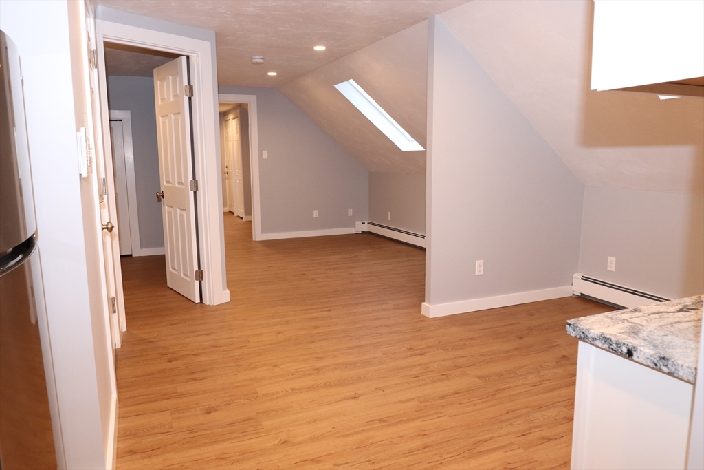 73 Everett Street, Unit 3 Middleboro, MA 02346 - Photo 8 of 17 a view of a room with wooden floor