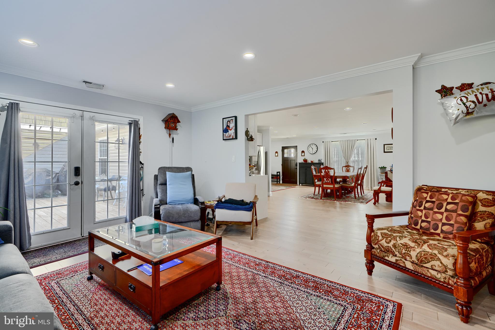 12330 Scaggsville Road Fulton, MD 20759 - Photo 12 of 40 a living room with furniture a rug and a large window