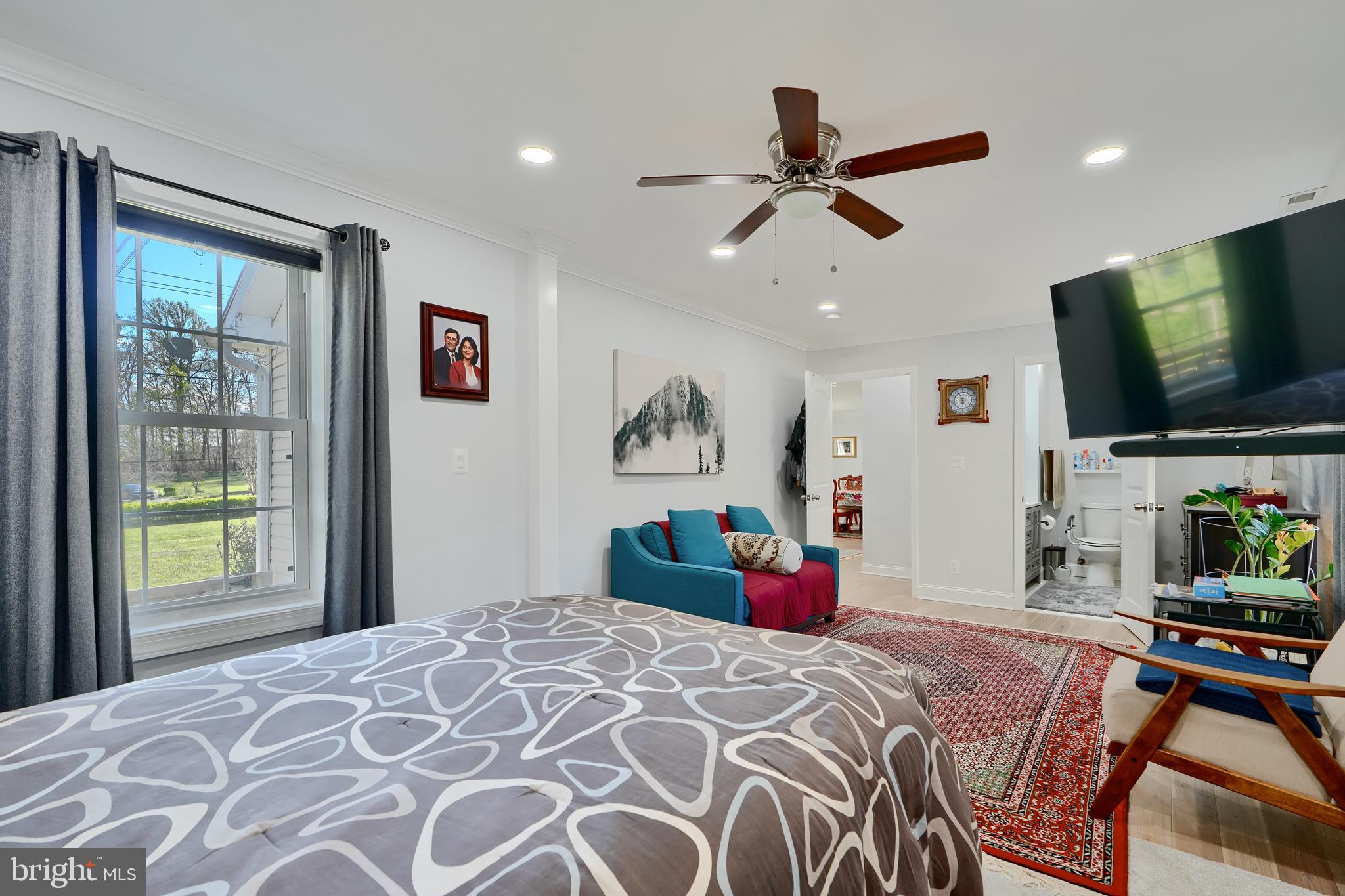 12330 Scaggsville Road Fulton, MD 20759 - Photo 21 of 40 a bedroom with a bed and a flat screen tv