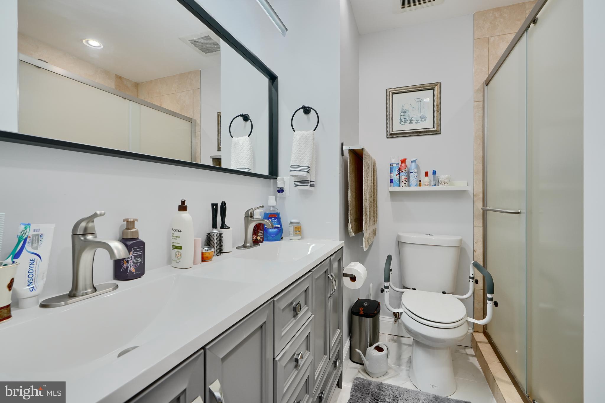 12330 Scaggsville Road Fulton, MD 20759 - Photo 22 of 40 a bathroom with a toilet sink and mirror