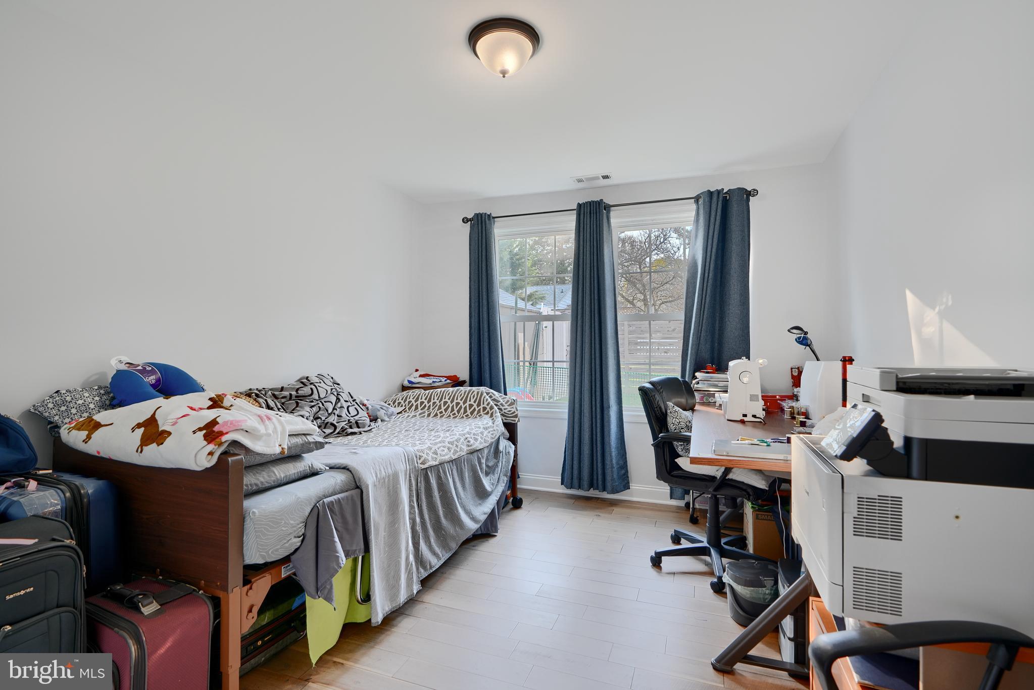 12330 Scaggsville Road Fulton, MD 20759 - Photo 24 of 40 a bedroom with a bed and a desk