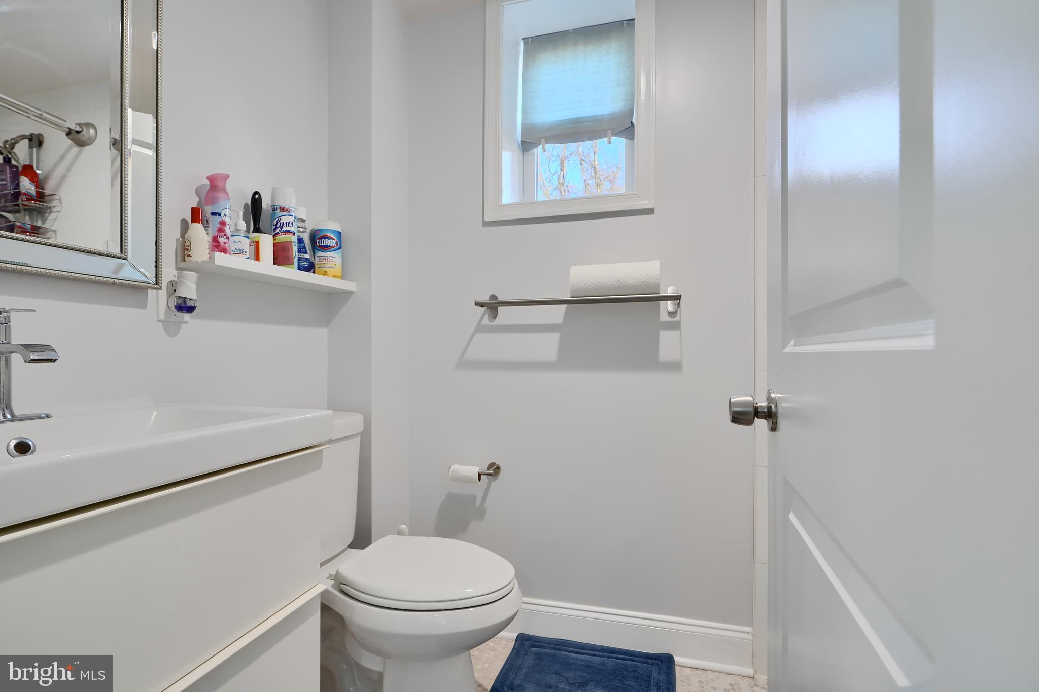 12330 Scaggsville Road Fulton, MD 20759 - Photo 26 of 40 a white toilet sitting next to a bathroom sink