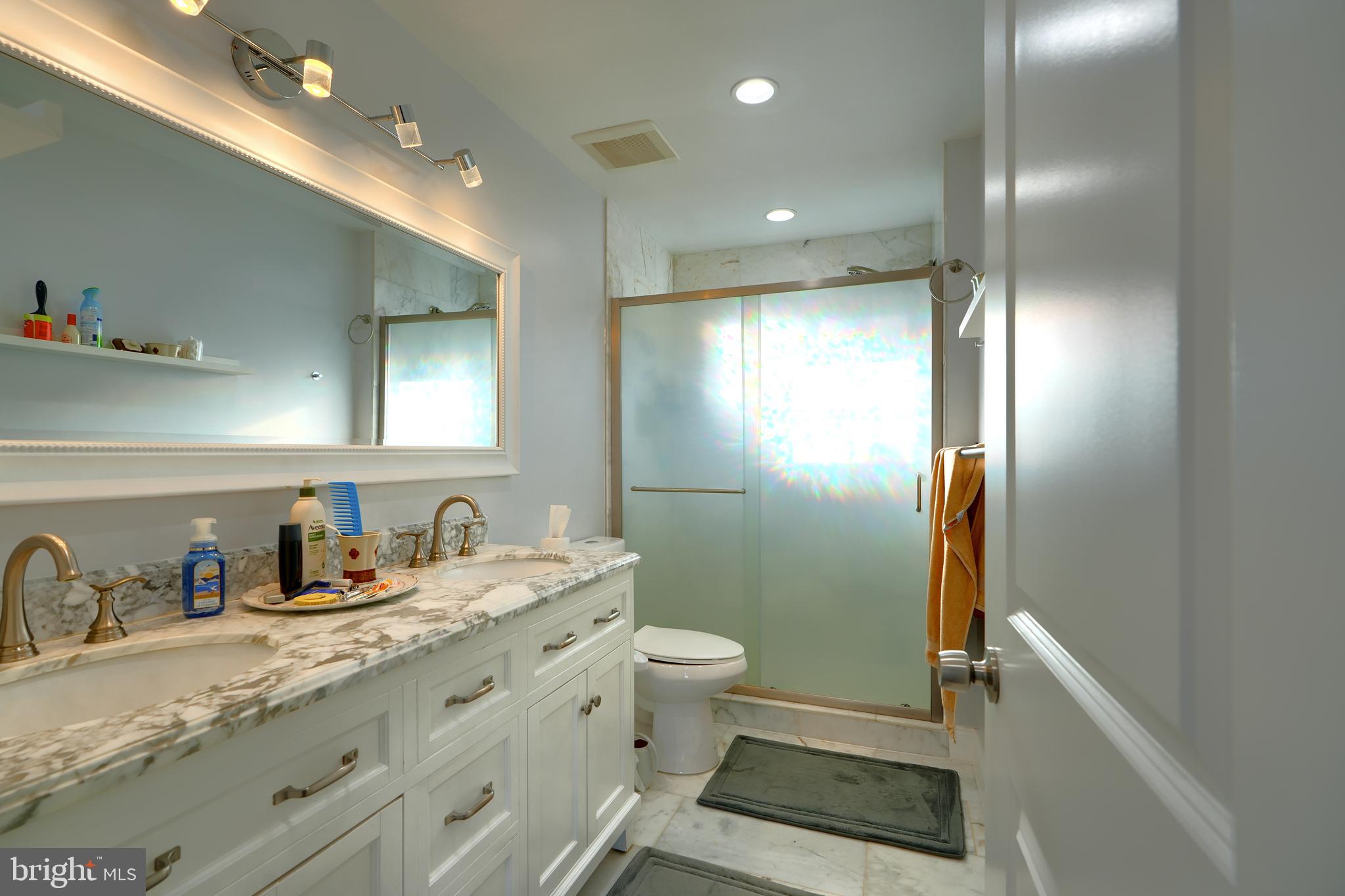 12330 Scaggsville Road Fulton, MD 20759 - Photo 32 of 40 a bathroom with a sink a toilet and shower