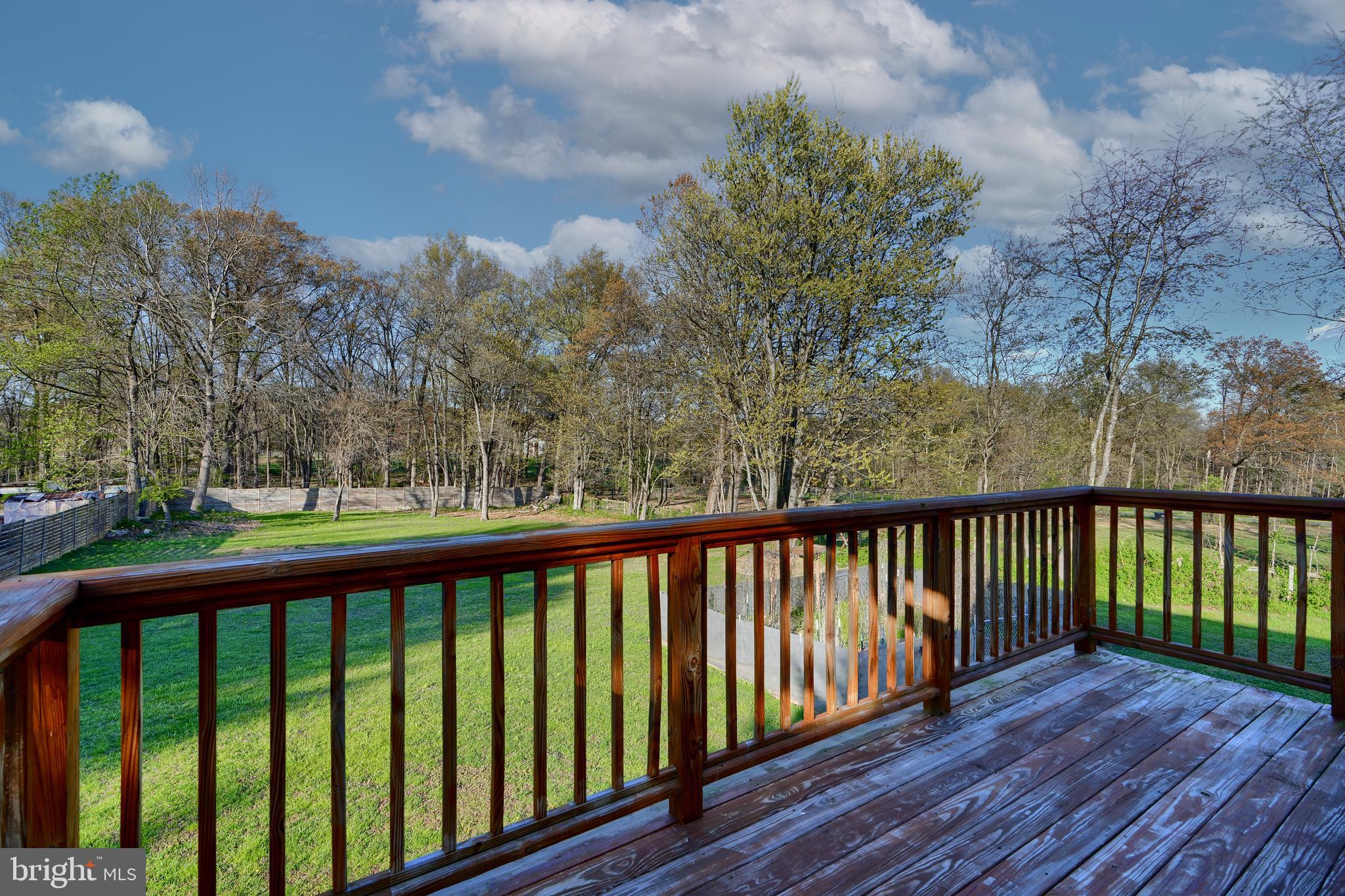 12330 Scaggsville Road Fulton, MD 20759 - Photo 34 of 40 a balcony with wooden floor and fence