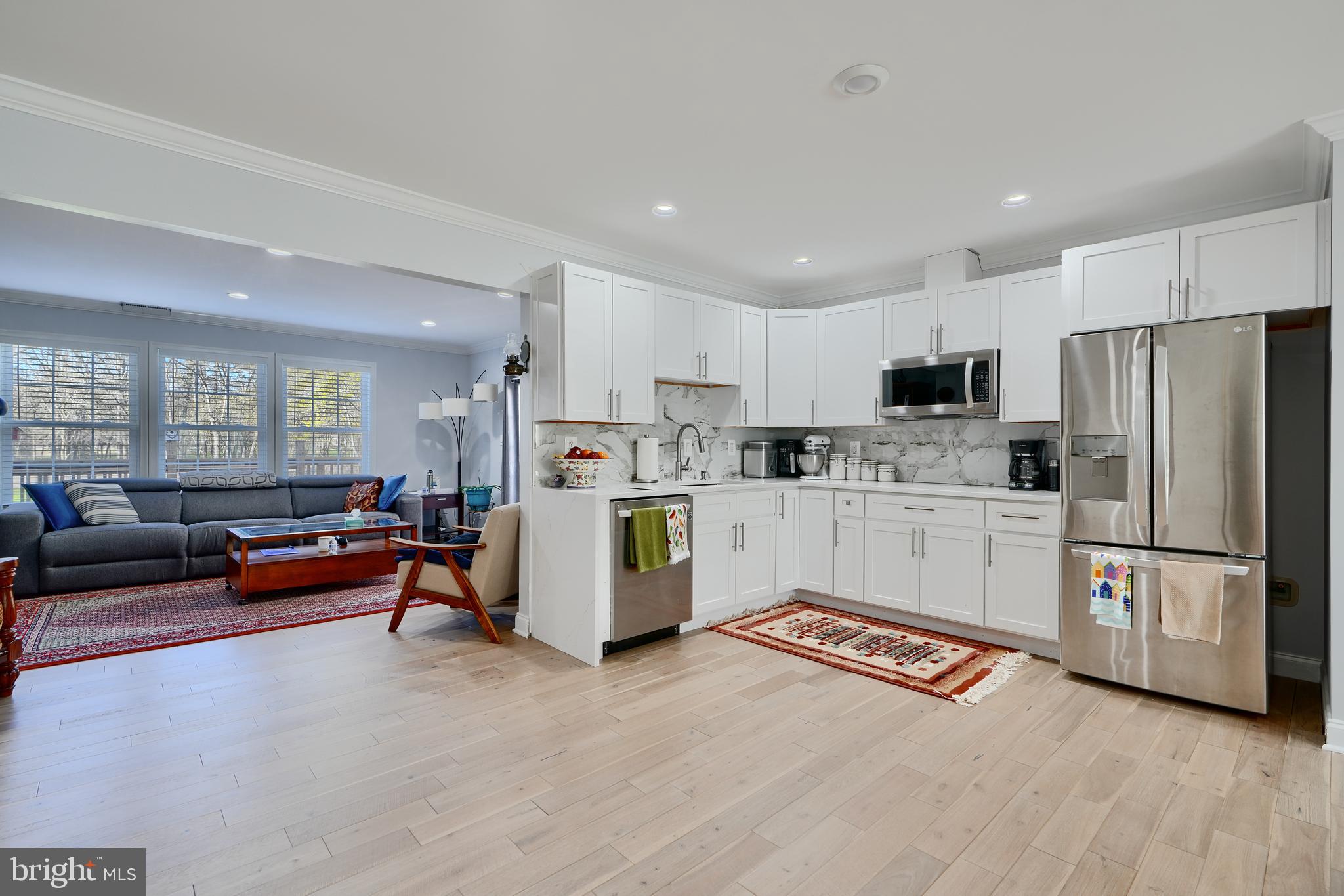 12330 Scaggsville Road Fulton, MD 20759 - Photo 8 of 40 a kitchen with stainless steel appliances a refrigerator and a stove top oven