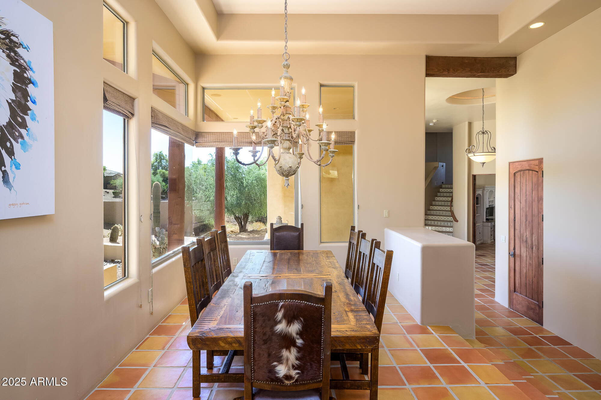 8540 East McDowell Road, Unit 29 Mesa, AZ 85207 - Photo 14 of 59 a view of a dining room with furniture a chandelier and wooden floor