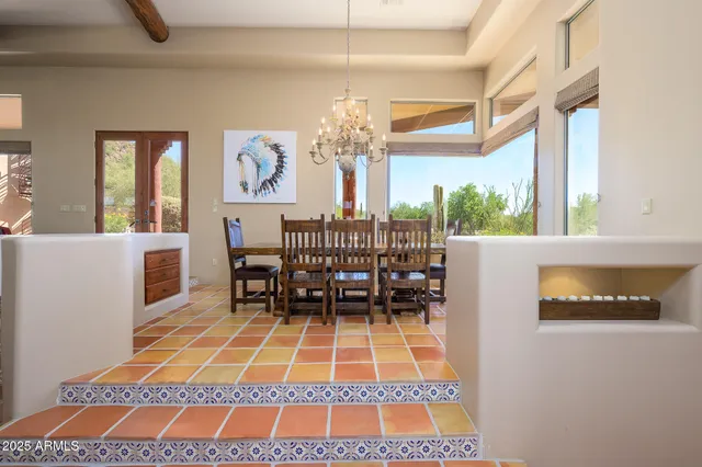 a view of an empty room with a fireplace and cabinet