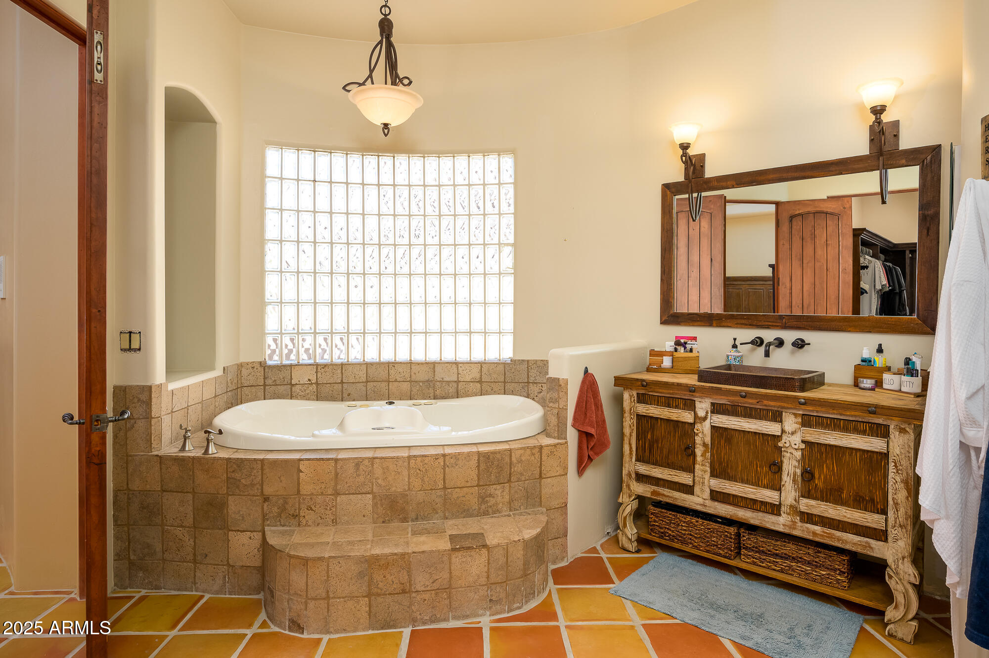 8540 East McDowell Road, Unit 29 Mesa, AZ 85207 - Photo 20 of 59 a bathroom with a bathtub and a sink