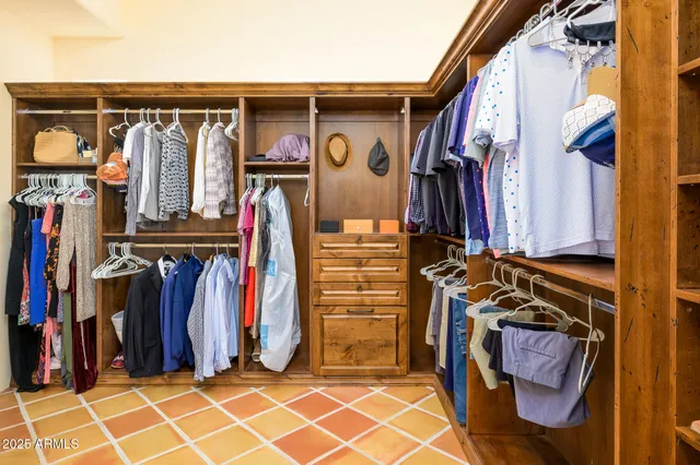 a view of a bedroom with wooden floor and entryway