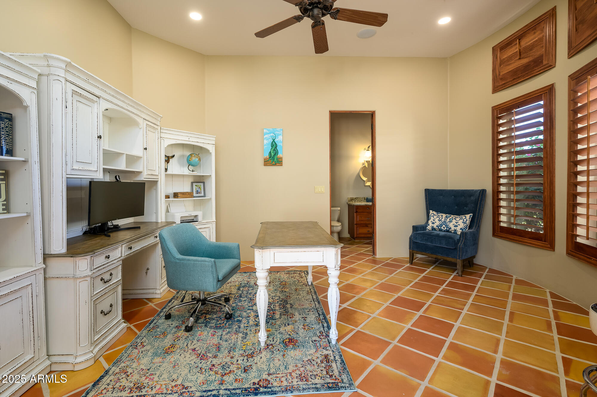 8540 East McDowell Road, Unit 29 Mesa, AZ 85207 - Photo 22 of 59 a living room with furniture a flat screen tv and kitchen view