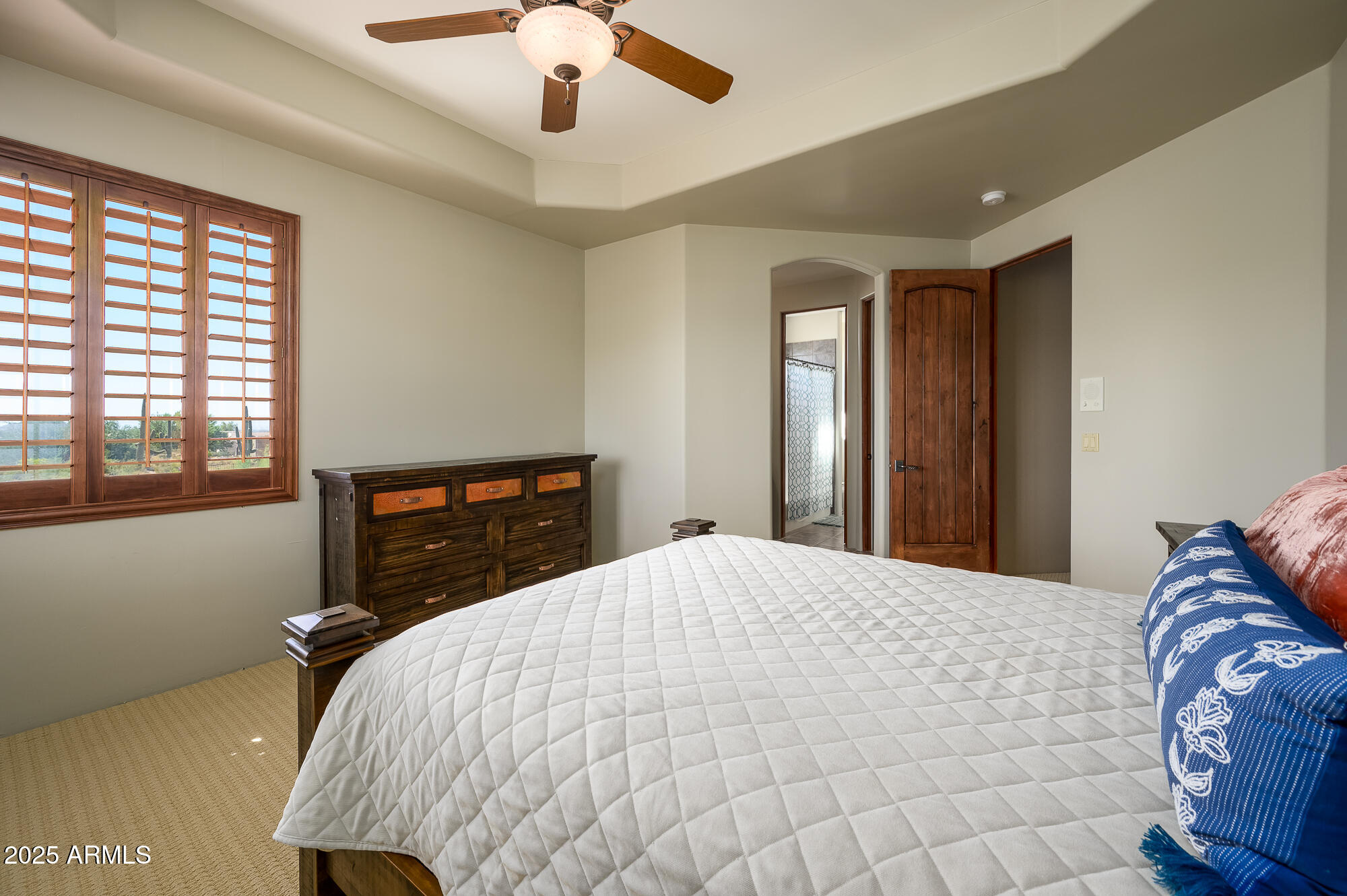 8540 East McDowell Road, Unit 29 Mesa, AZ 85207 - Photo 27 of 59 a bedroom with a bed and a large window