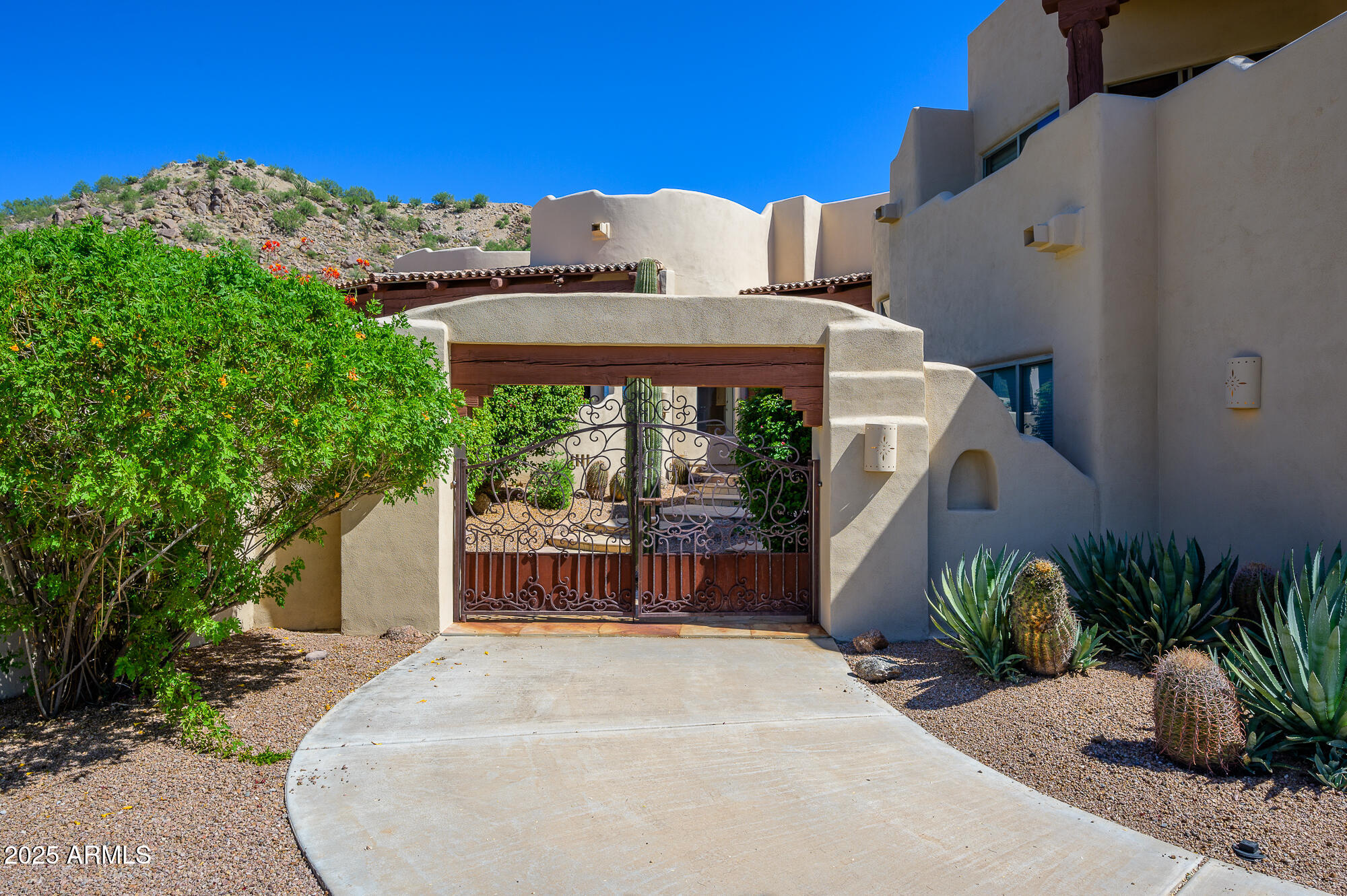 8540 East McDowell Road, Unit 29 Mesa, AZ 85207 - Photo 3 of 59 a wooden bench sitting in front of a building