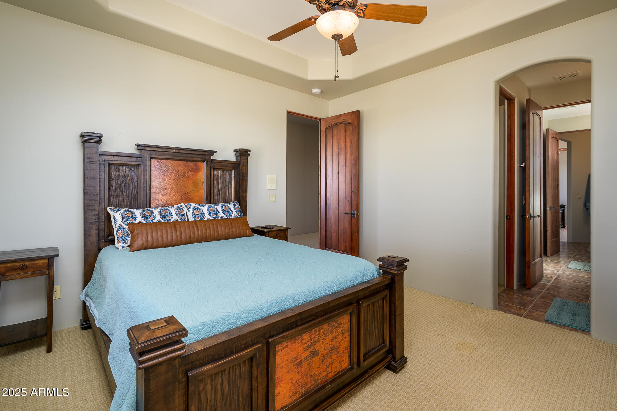 8540 East McDowell Road, Unit 29 Mesa, AZ 85207 - Photo 32 of 59 a bed sitting in a bedroom next to a window