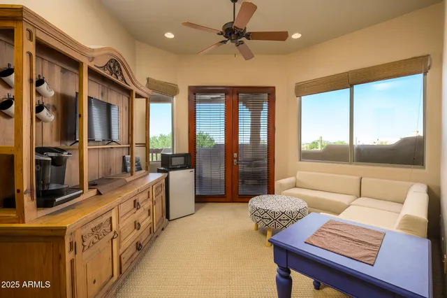 a view of a room with gym equipment and a large window