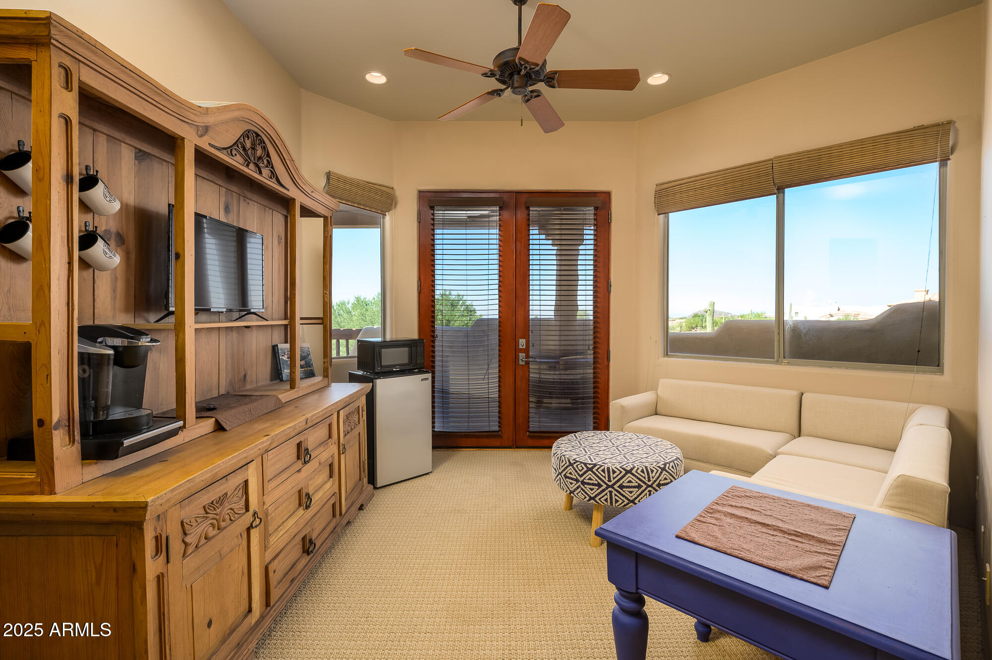 8540 East McDowell Road, Unit 29 Mesa, AZ 85207 - Photo 34 of 59 a living room with furniture and a flat screen tv