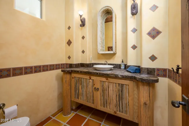 a view of a chairs and table in the roof deck