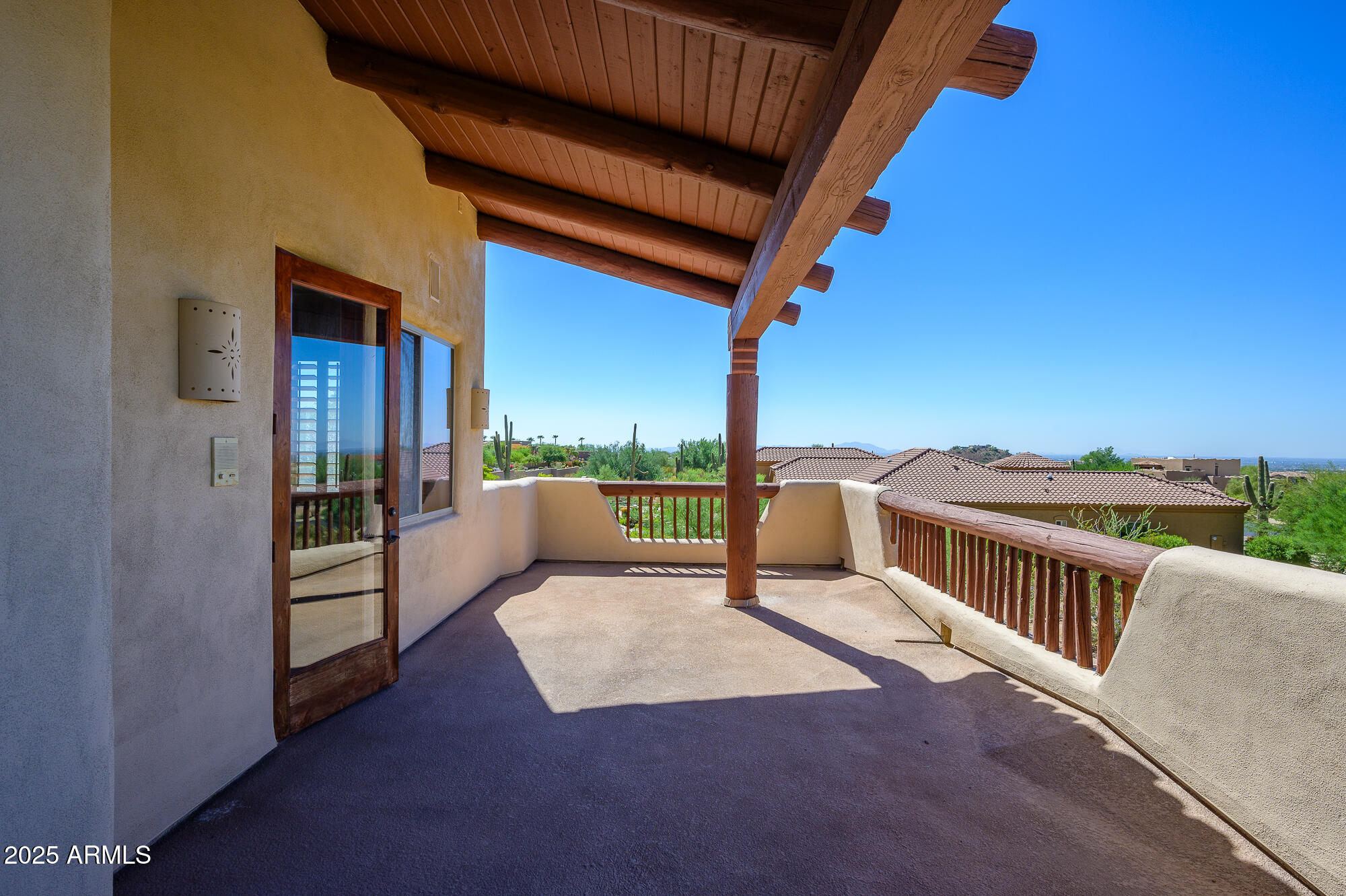 8540 East McDowell Road, Unit 29 Mesa, AZ 85207 - Photo 40 of 59 a view of a roof deck with couches and wooden floor