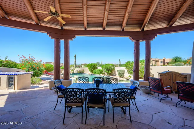 a swimming pool with outdoor seating and yard