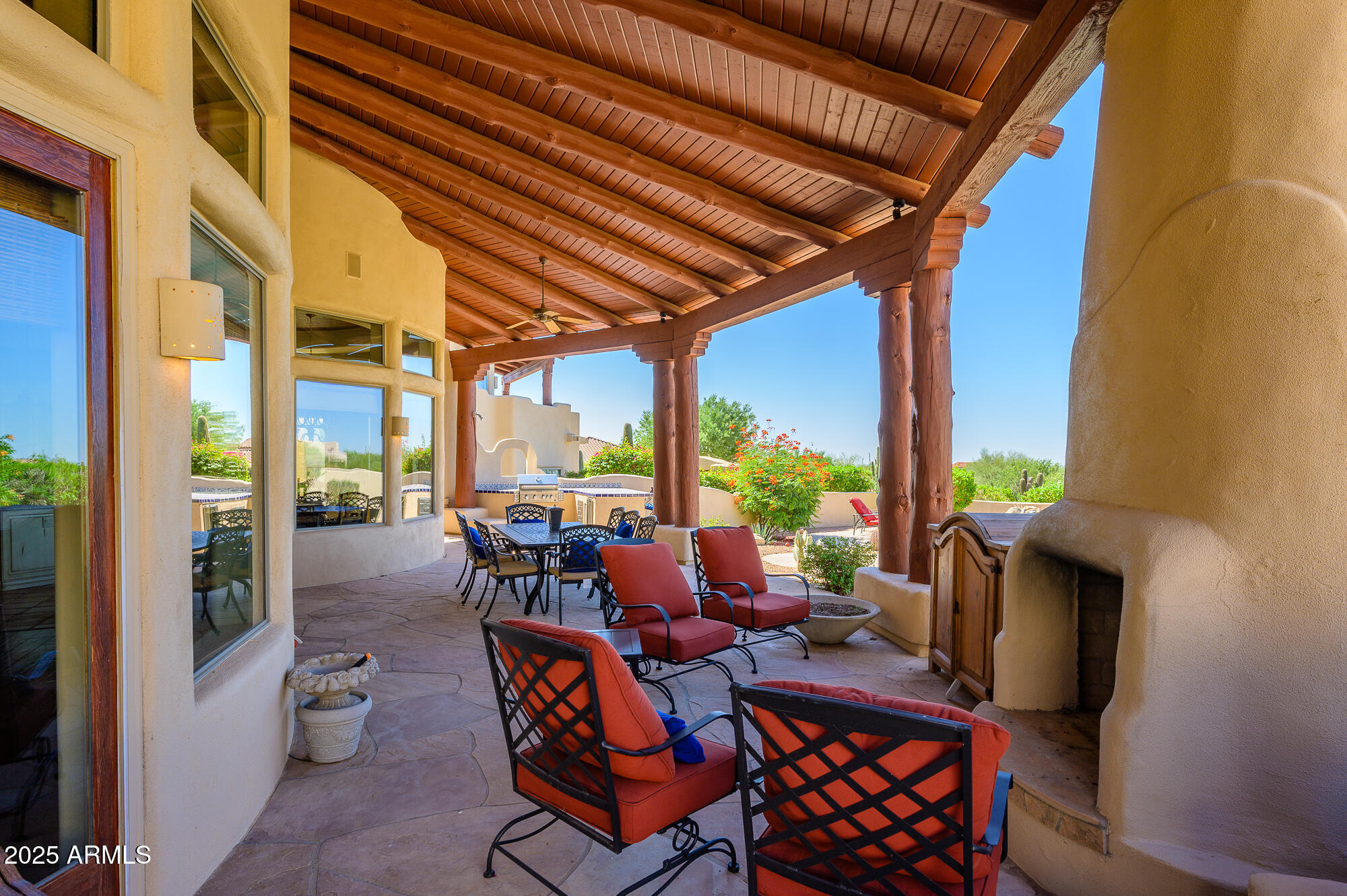 8540 East McDowell Road, Unit 29 Mesa, AZ 85207 - Photo 43 of 59 a view of an outdoor dining space with furniture and garden view