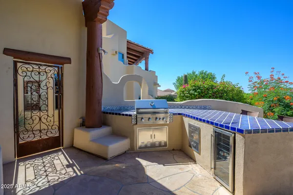 a view of a chairs and table in patio