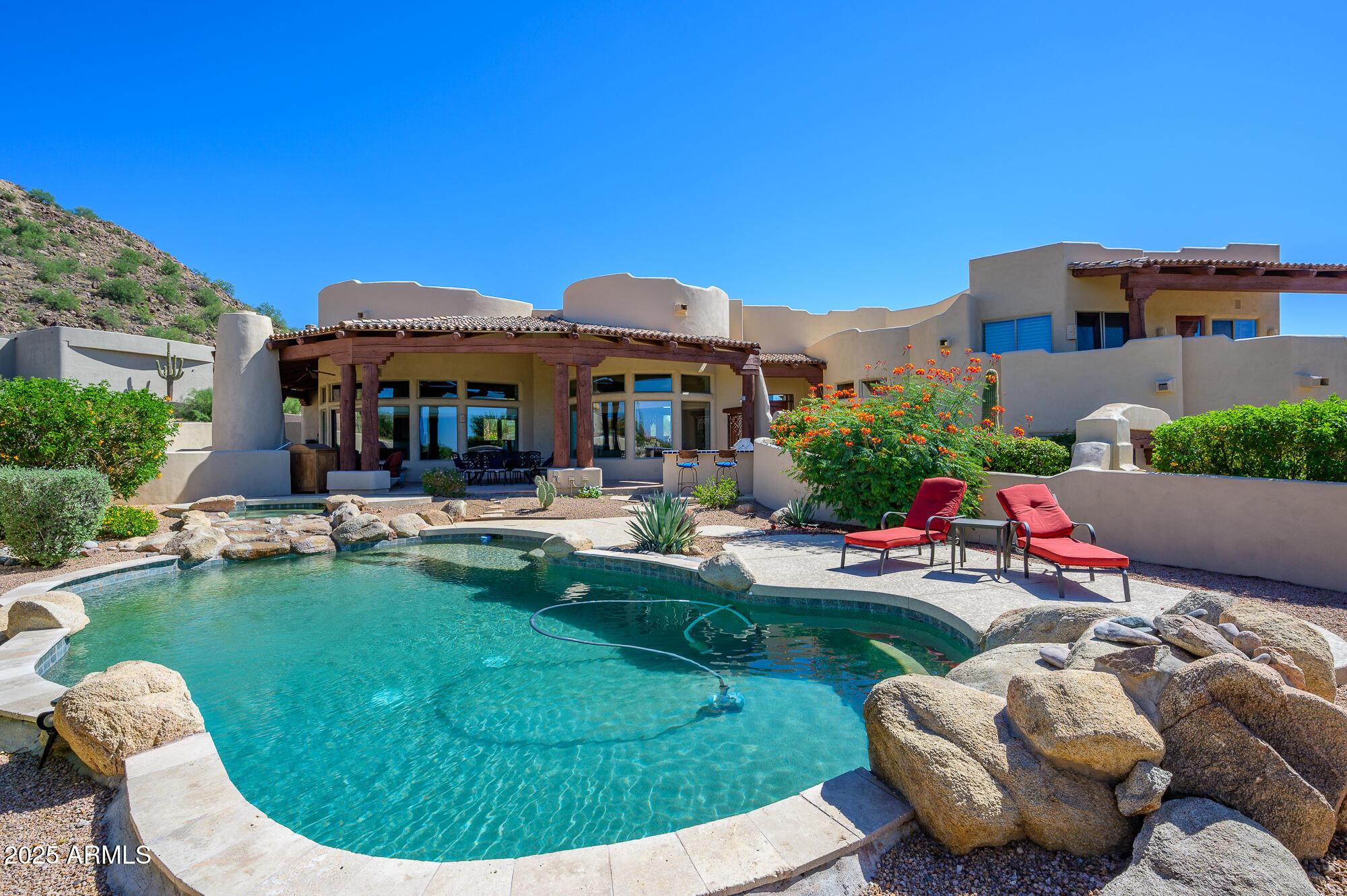 8540 East McDowell Road, Unit 29 Mesa, AZ 85207 - Photo 48 of 59 a view of a house with swimming pool and porch