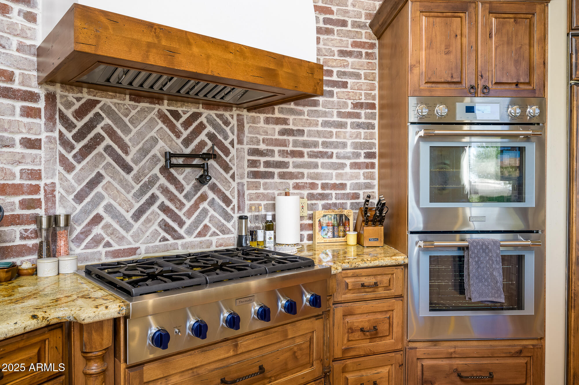 8540 East McDowell Road, Unit 29 Mesa, AZ 85207 - Photo 6 of 59 a stove top oven sitting inside of a kitchen