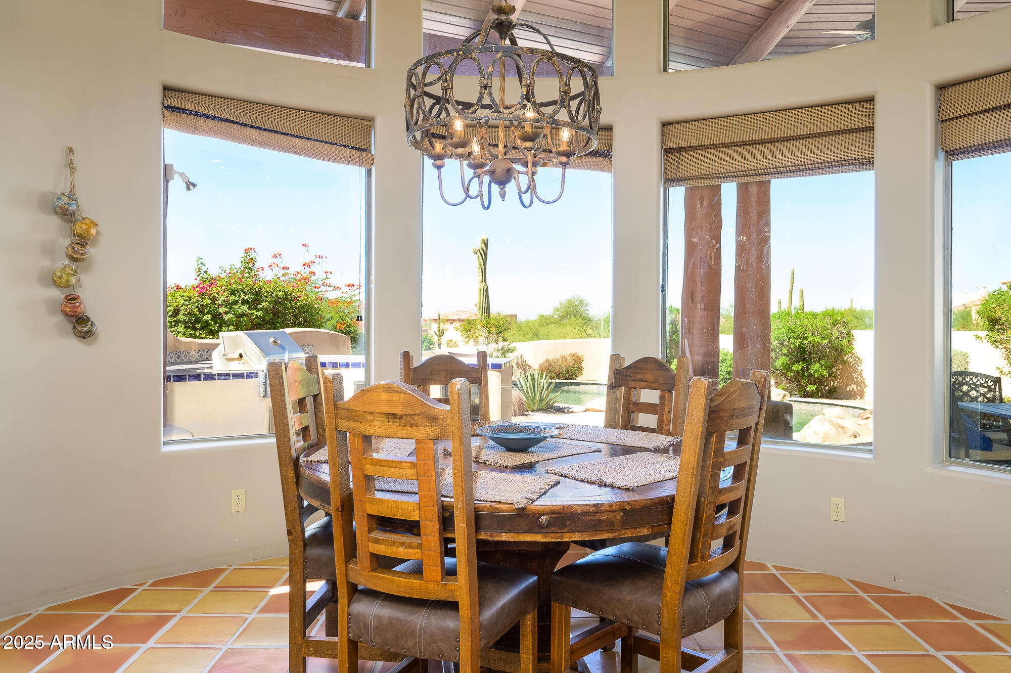 8540 East McDowell Road, Unit 29 Mesa, AZ 85207 - Photo 8 of 59 a view of a dining room with furniture a chandelier and wooden floor