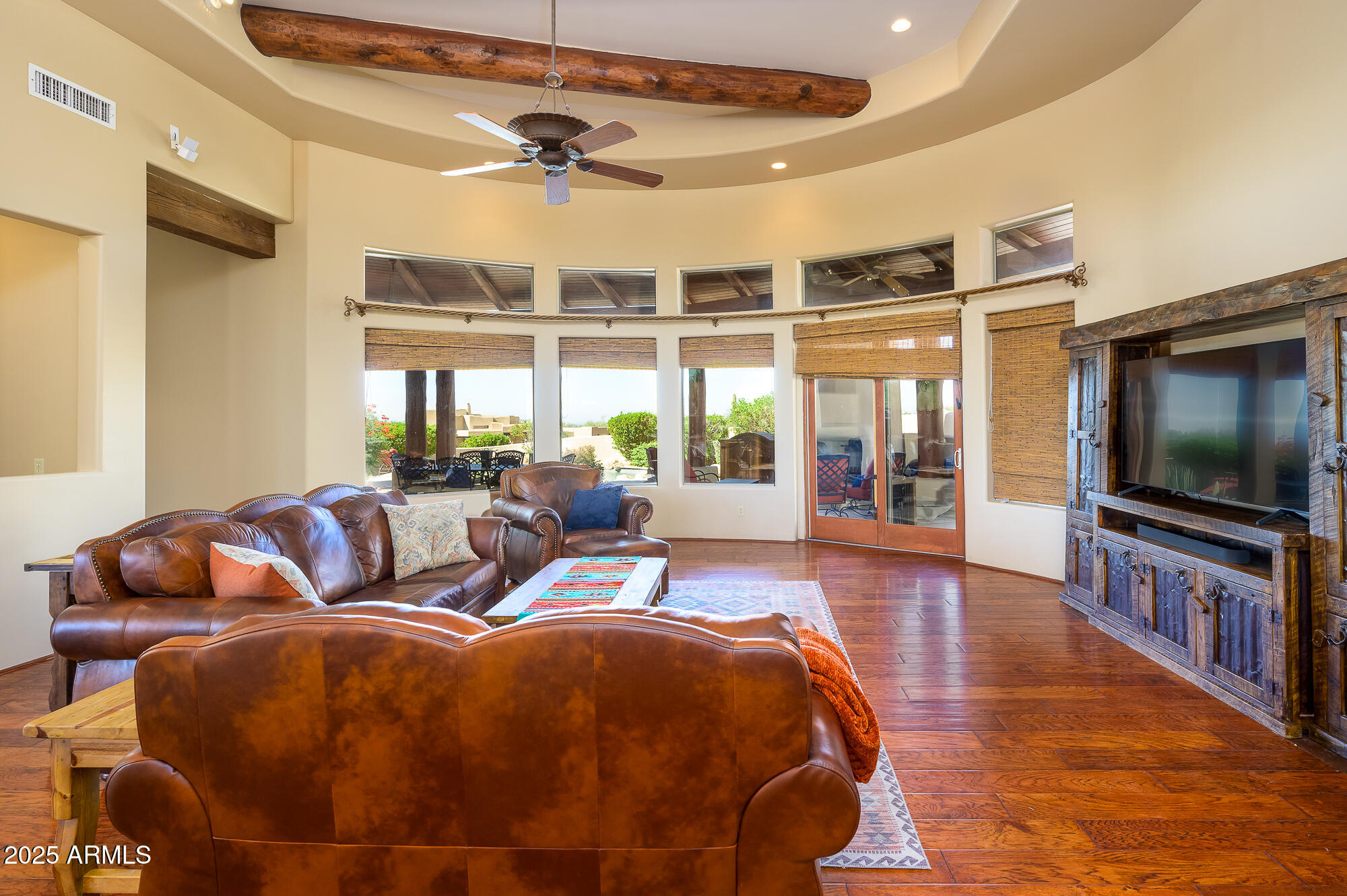 8540 East McDowell Road, Unit 29 Mesa, AZ 85207 - Photo 9 of 59 a living room with furniture and a flat screen tv