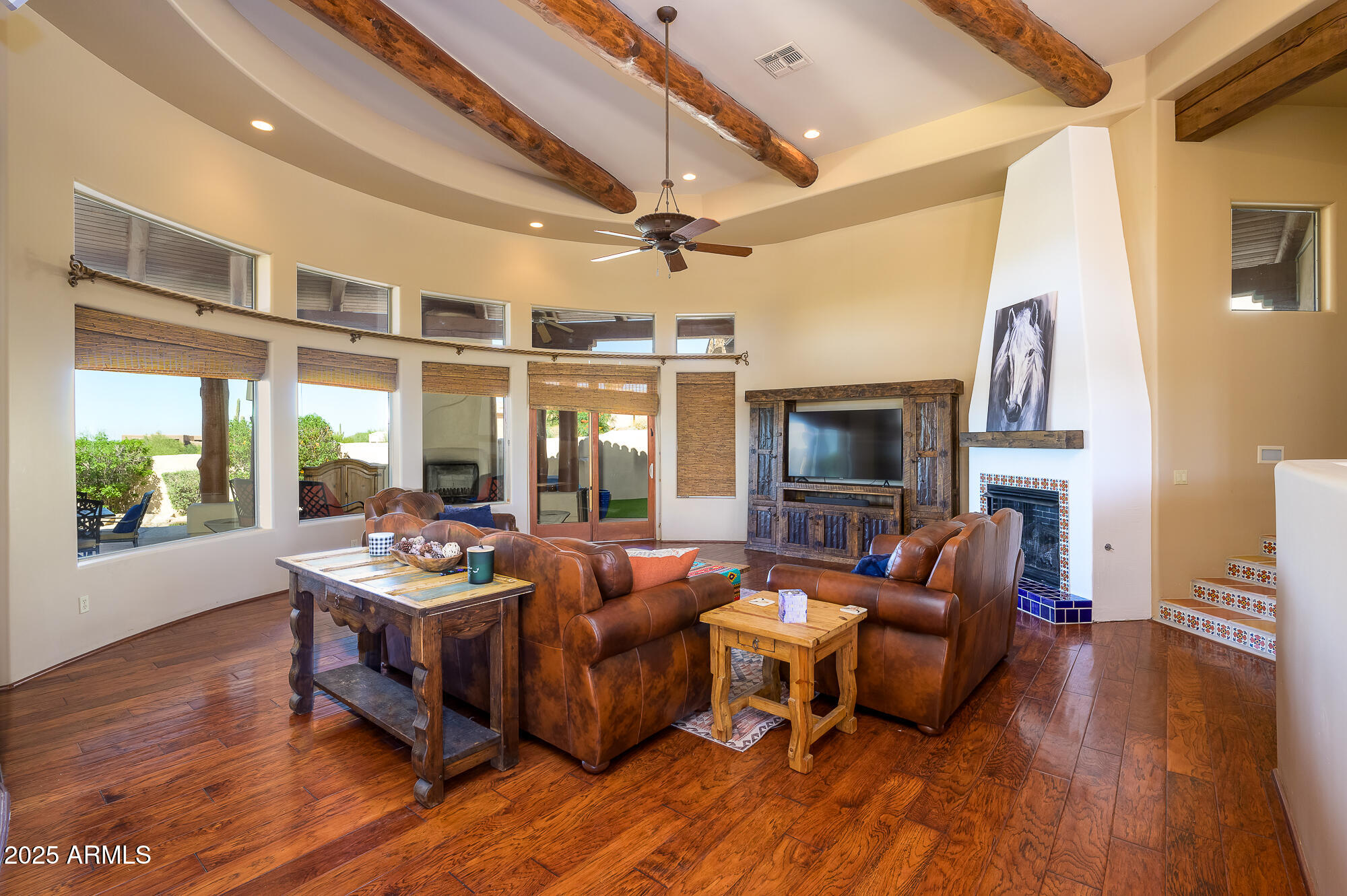 8540 East McDowell Road, Unit 29 Mesa, AZ 85207 - Photo 10 of 59 a living room with furniture fireplace and wooden floor