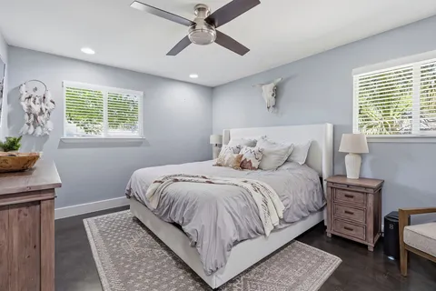 a bedroom with a bed and a window