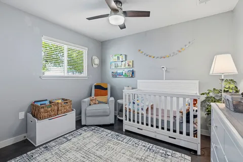 a bedroom with furniture and a window