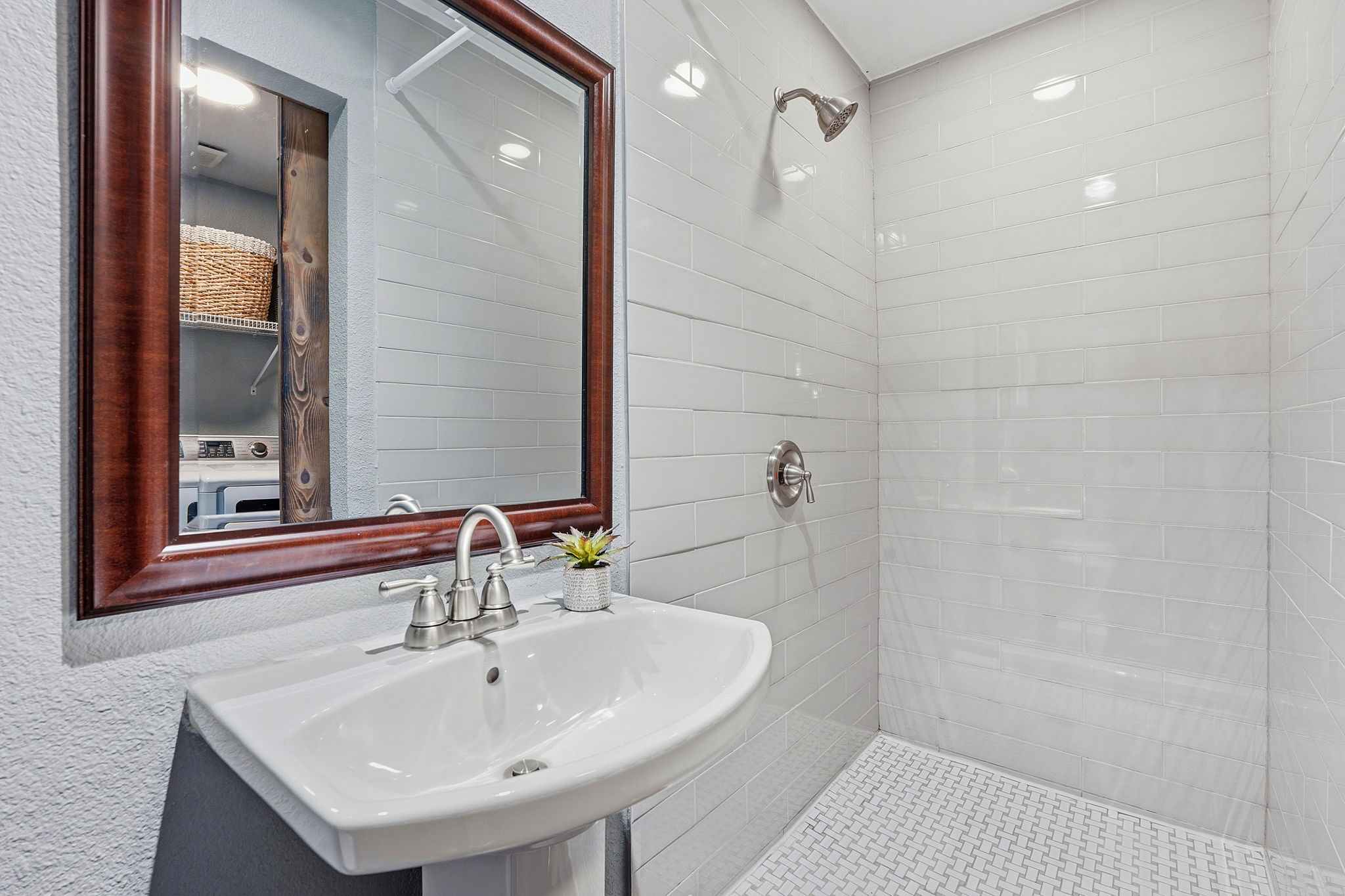 805 Nile Street Austin, TX 78702 - Photo 17 of 22 a bathroom with a sink a shower and a mirror