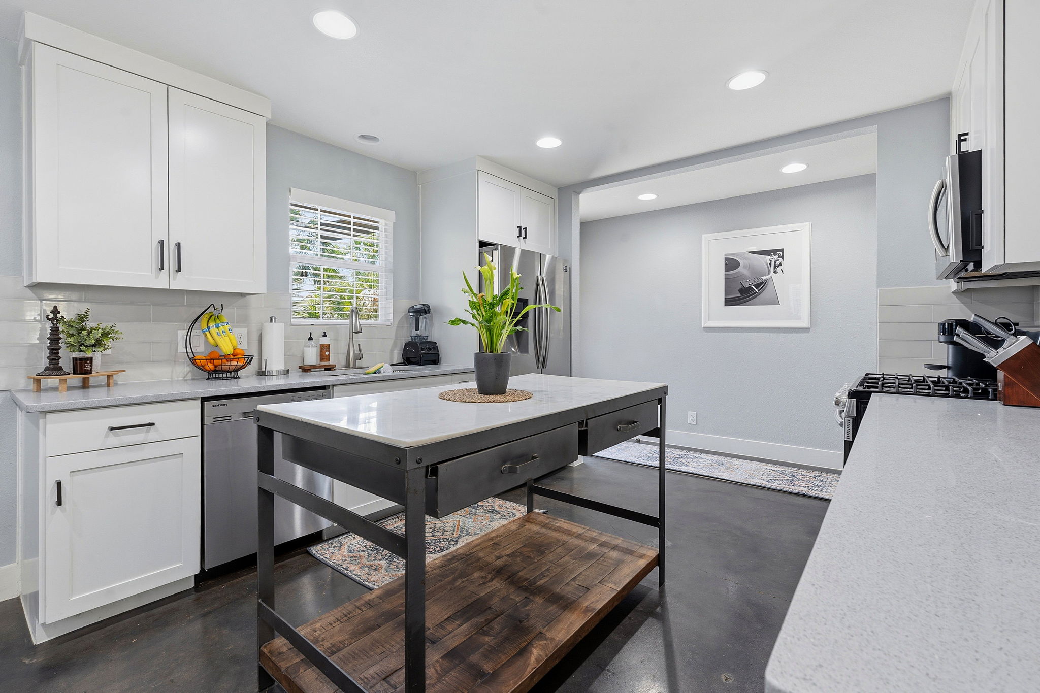 805 Nile Street Austin, TX 78702 - Photo 6 of 22 a kitchen with a table and chairs in it