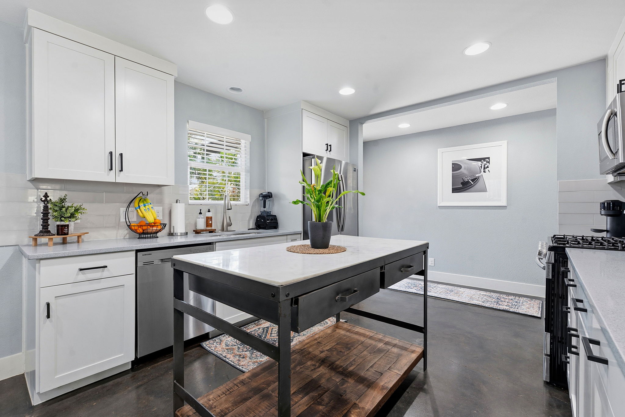805 Nile Street Austin, TX 78702 - Photo 7 of 22 a view of a kitchen with a table and chairs in it